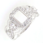 Sterling silver semi mount ring setting featuring a crisscross swirl shank with white topaz stones, size 8x6mm.